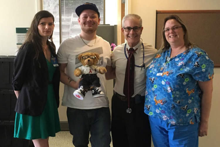 Josh Middleton with his healthcare team