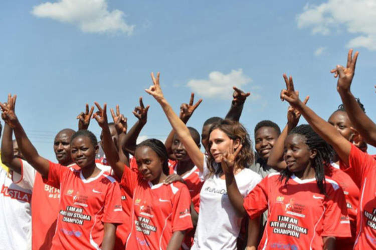 UNAIDS International Goodwill Ambassador Victoria Beckham with the girls team at the launch of the national football campaign Maisha Kick Out HIV Stigma, which aims to motivate young people to get tested for HIV