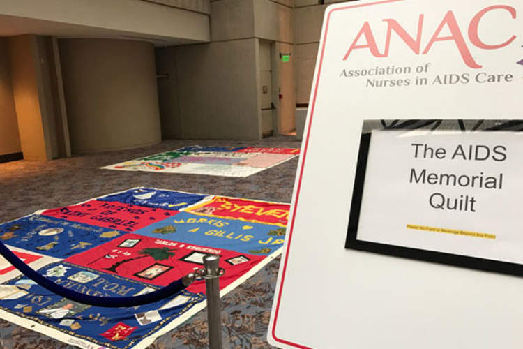 ANAC conference sign and AIDS Memorial Quilt