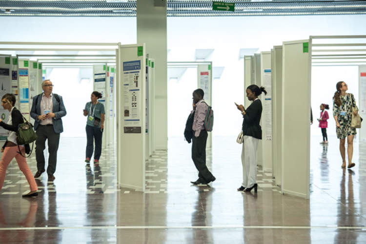 Attendees browse poster presentations at IAS 2017 in Paris, France