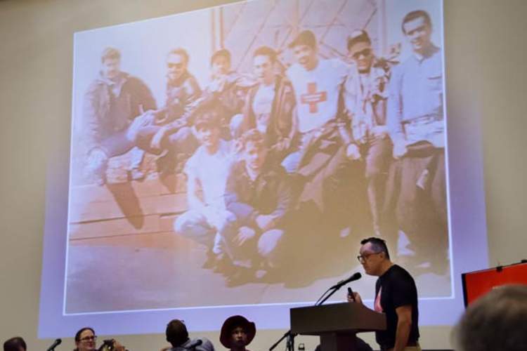 Fernando Marsical speaking at Hidden Histories; background photo of Latina/o Caucus members also by Fernando Mariscal (Credit: Molly Gingras)
