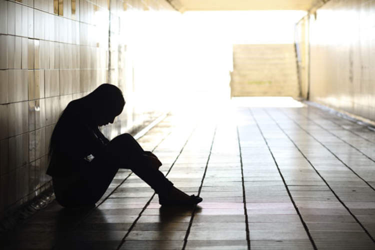 silhouette of person in a tunnel