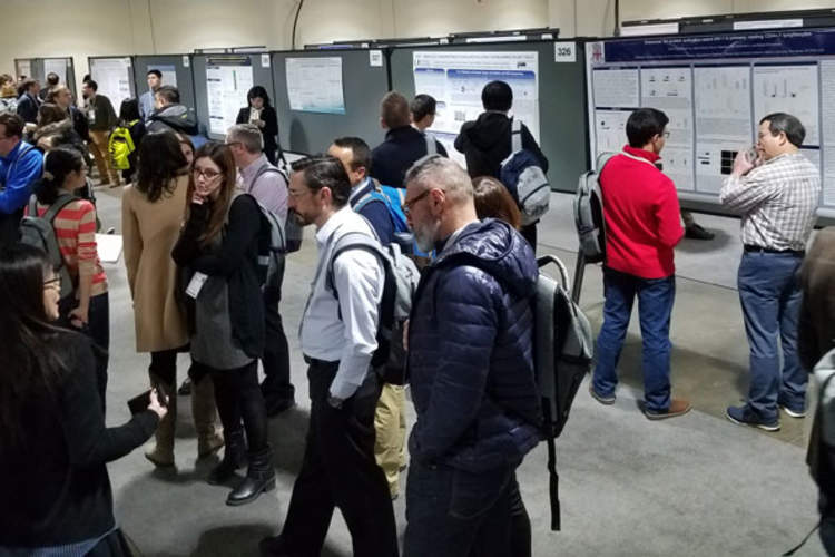 Attendees in the poster hall at CROI 2018