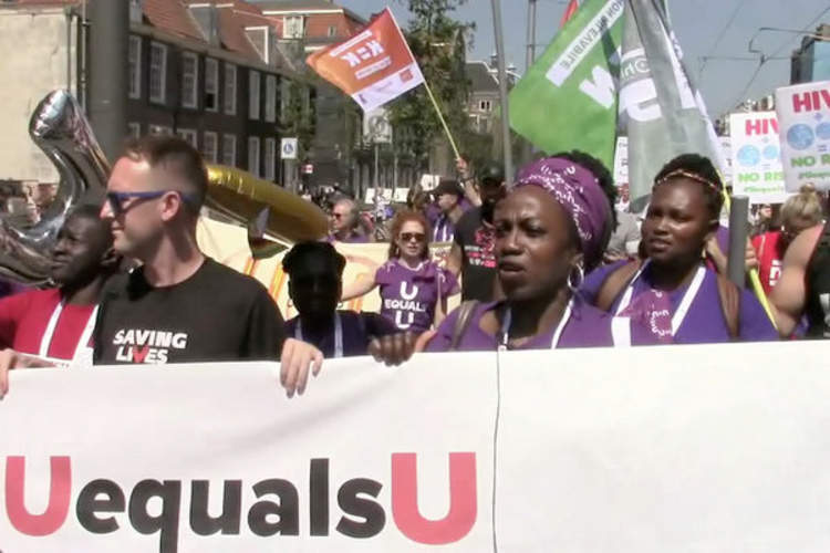 HIV activists march in Amsterdam on July 23 during the 2018 International AIDS Conference