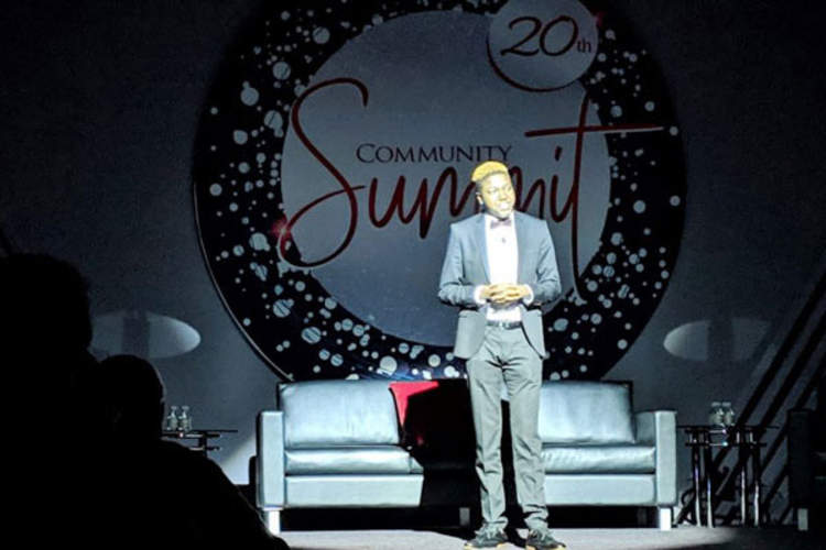 Mary Bowman performing at the opening of the 20th Anniversary Community Summit