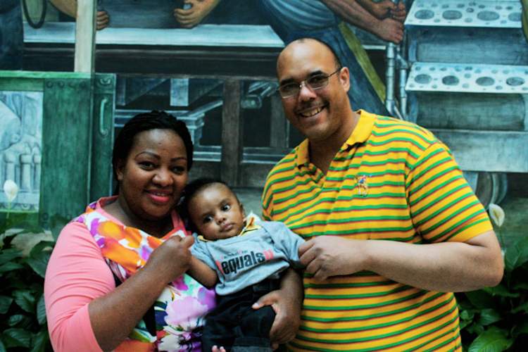 Aaron Anderson with Claire Gasamagera and their son Calvin.