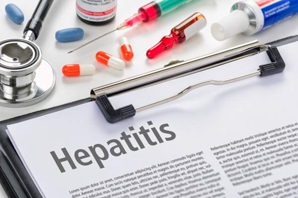 hepatitis word on clipboard alongside medical equipment