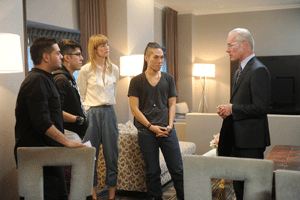 Tim Gunn with the final four contestants in season 8 of Project Runway.
