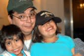 Shana's husband, Bear, with daughters Danica and Mallory.