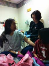 Shana, with her family, at a recent trip to the emergency room.