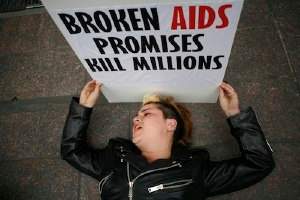 An activist 'dies' in front of the German mission.