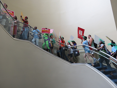 Activists ascend the stairs at the Walter Washington Convention Center to begin the march.