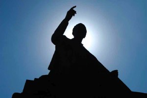silhouette of man on podium