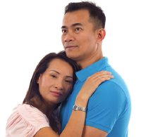 woman and man holding each other