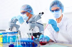 scientists with microscopes