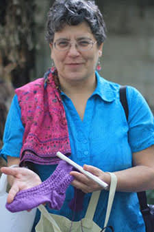Mom showing off the socks she knitted me. She also spins, sews and quilts. Oh, and makes terrible puns. She's probably very disappointed there are no bad puns in this whole piece. Sorry, Mom.