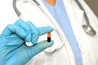 medical professional holding pill