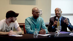 At the Atlanta Principles press conference, ACT UP New York's James Krellenstein and Adolph Arromand of National AIDS and Education Services for Minorities (NAESM) consider the testimony of longtime Atlanta activist living with HIV, Craig Washington of AI