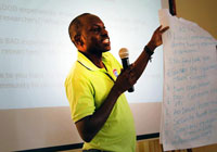 MAAYGO's Kennedy Otieno presents during the meeting.