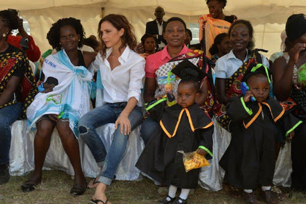 UNAIDS International Goodwill Ambassador Victoria Beckham celebrates with the mothers and their children at the HIV-exposed infant graduation ceremony