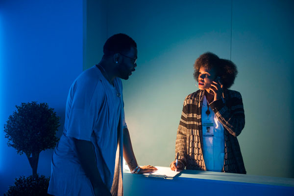 Marcus, in the opening scene of <i>As Much As I Can</i>, with the clinic receptionist