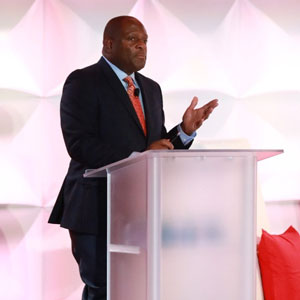 Douglas Brooks, Senior Director of Community Engagement at Gilead Sciences, opening the Gilead COMPASS Initiative launch event at the Georgia Aquarium in Atlanta on December 12 (Credit: Gregg Willett)