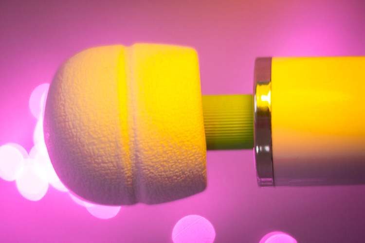vibrator with yellow lighting, pink background