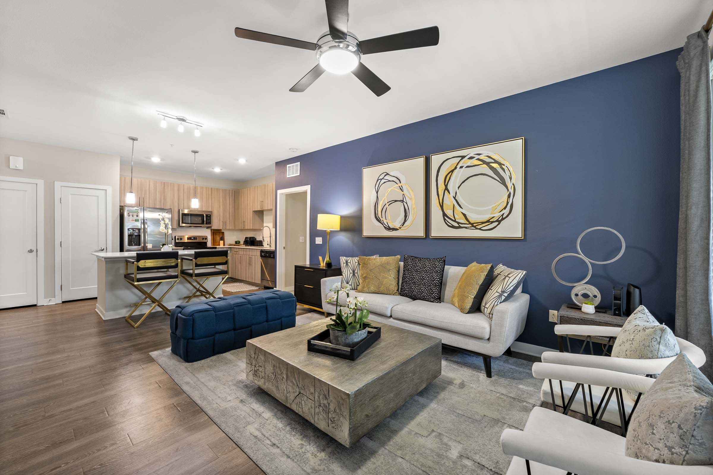 Living room and kitchen at Camden Lake Buena Vista apartments in Orlando, FL.
