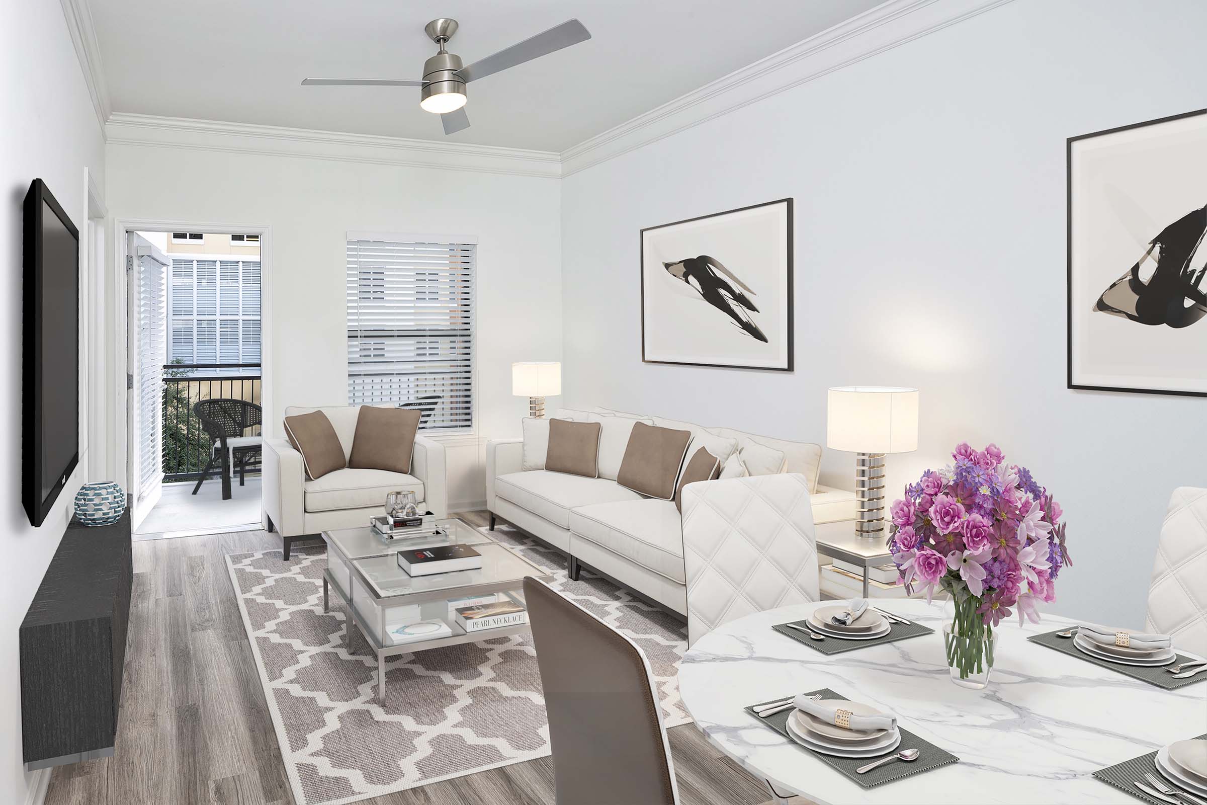 Beautifully renovated living room featuring crown molding and ceiling fan with LED lighting.