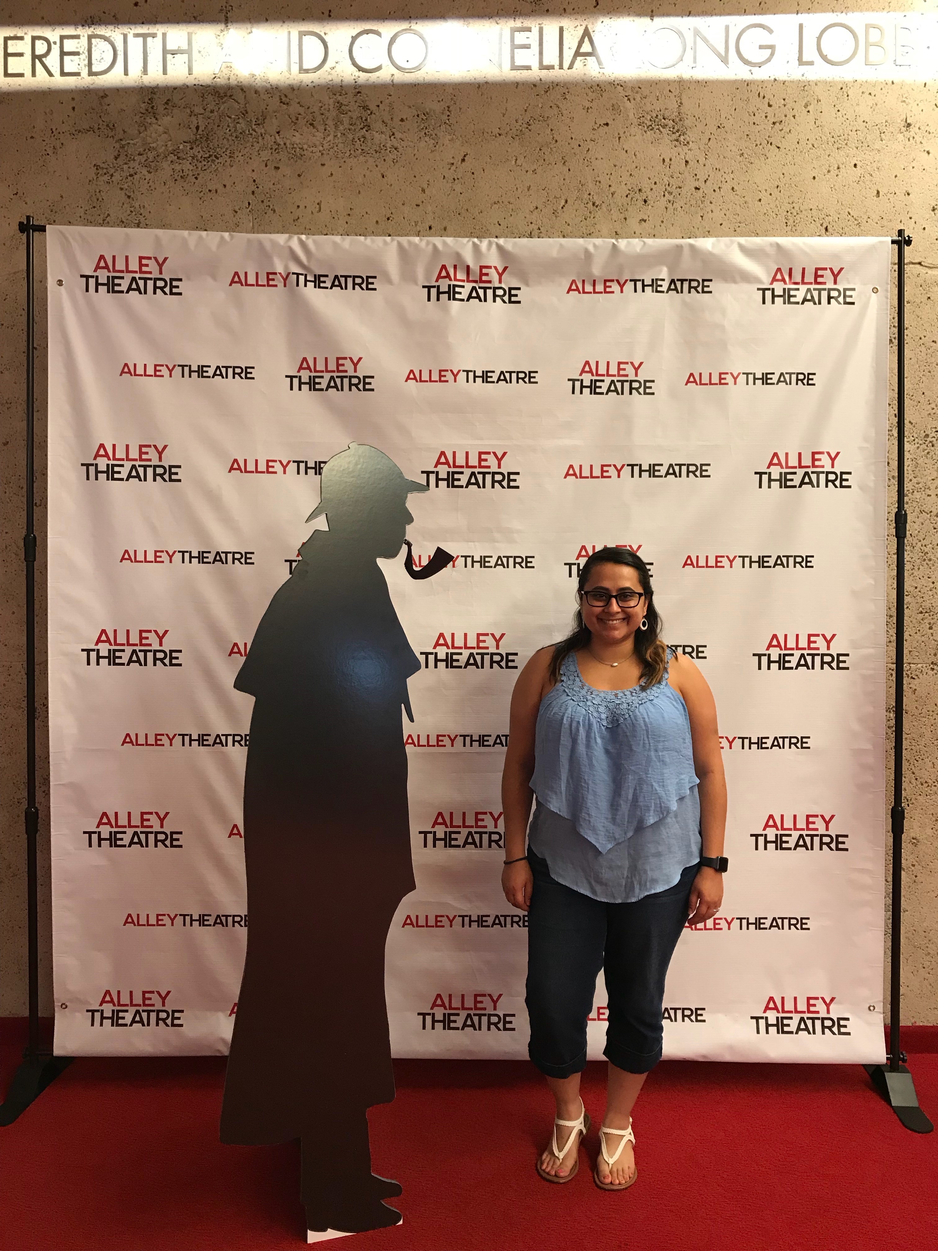 Jodie with Holmes and Watson backdrop