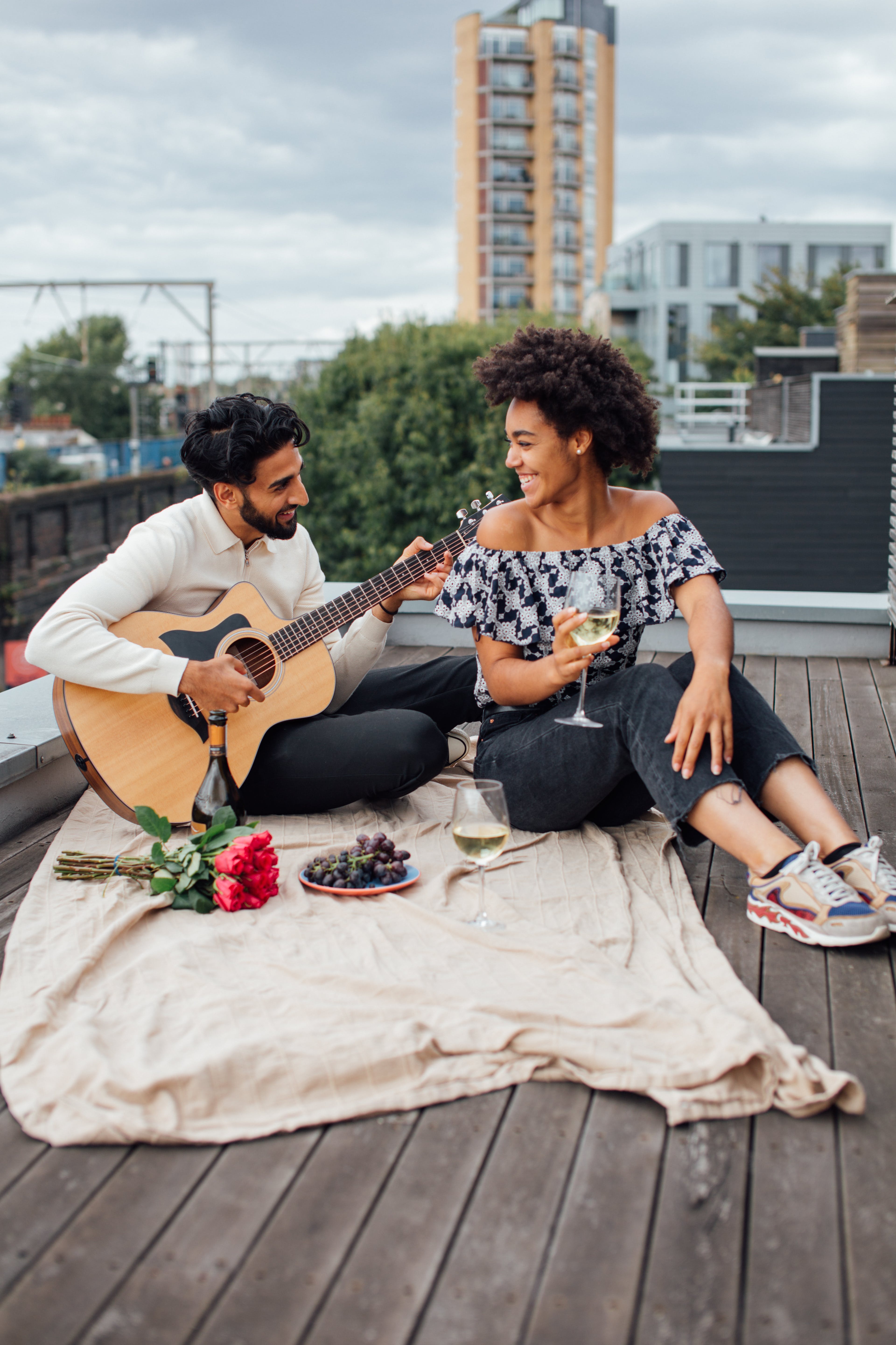 Sitting on a rooftop celebrating V-day in Nashville https://www.pexels.com/photo/man-and-woman-sitting-on-the-rooftop-5332423/ 