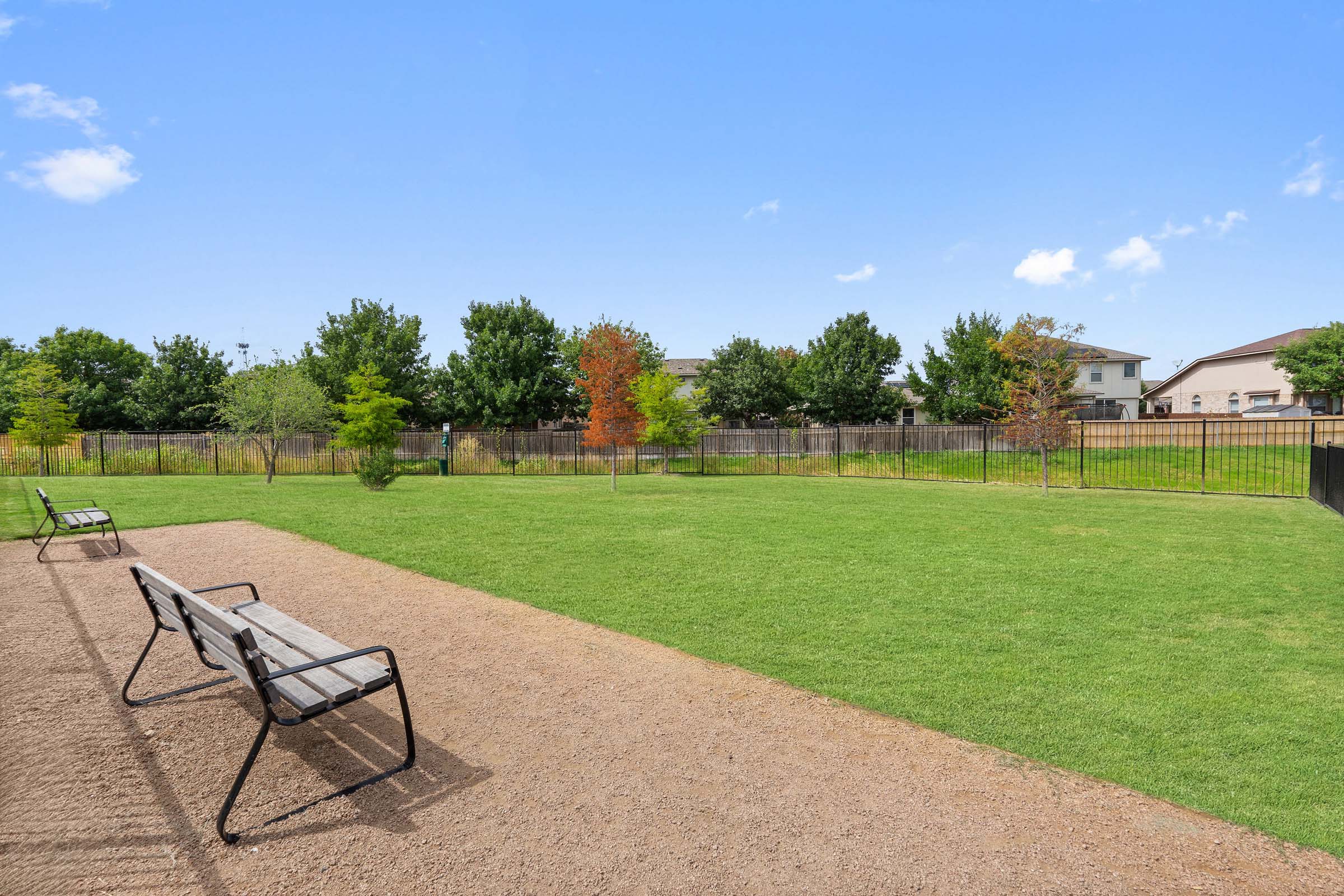 Dog Park with benches at Camden Leander apartments in Leander, Tx