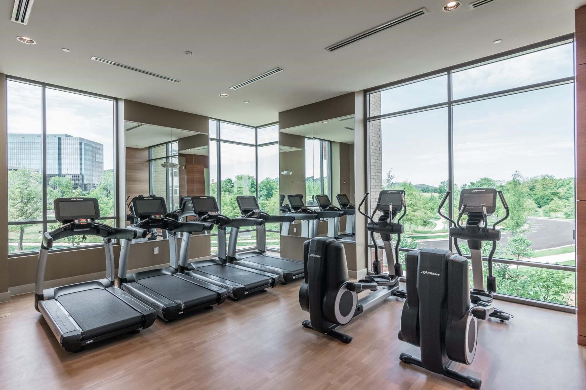 Two-story fitness center with cardio equipment and incredible views