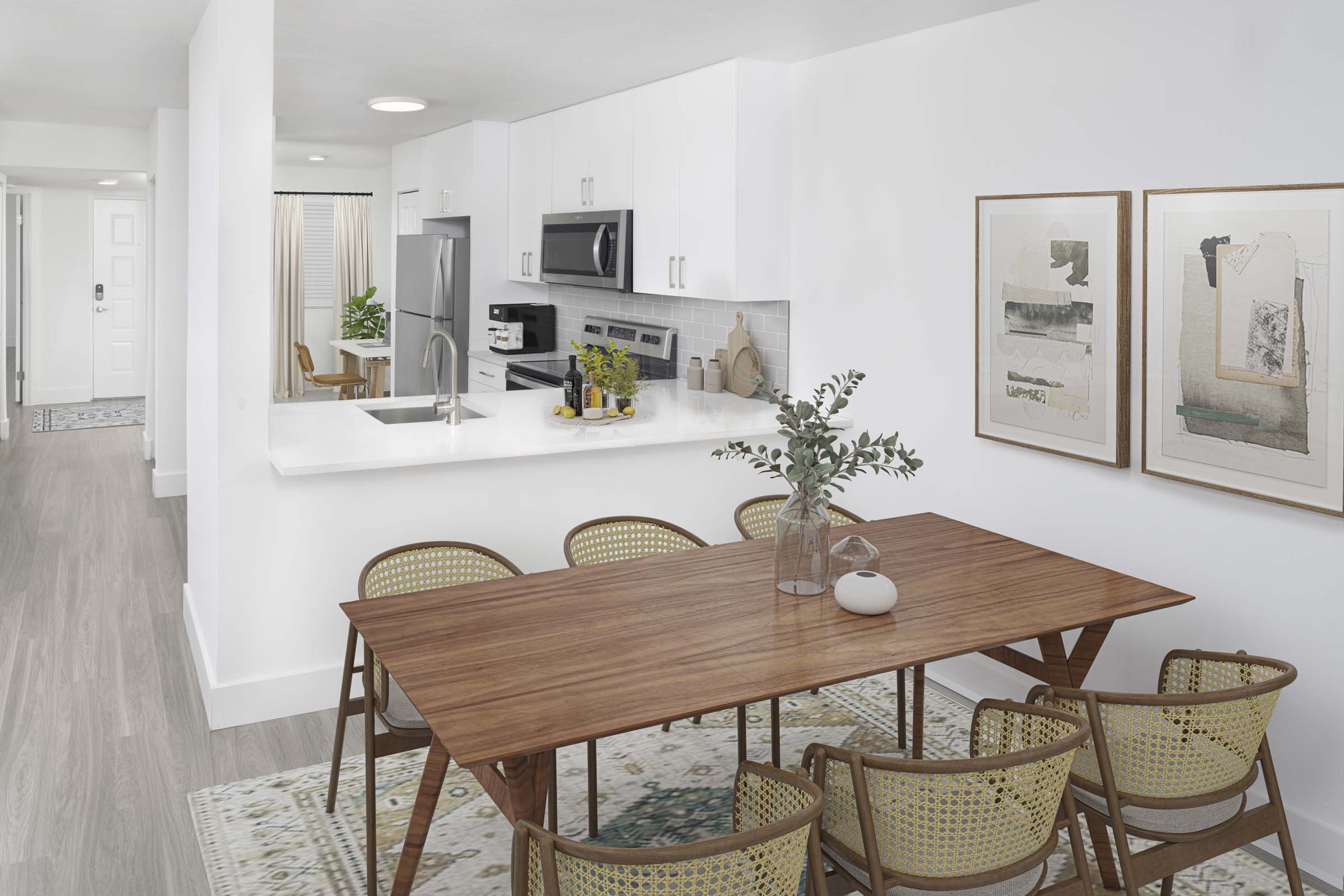 Open-concept dining and kitchen space in the Alberti floorplan at Camden Portofino in Pembrooke Pines, FL.