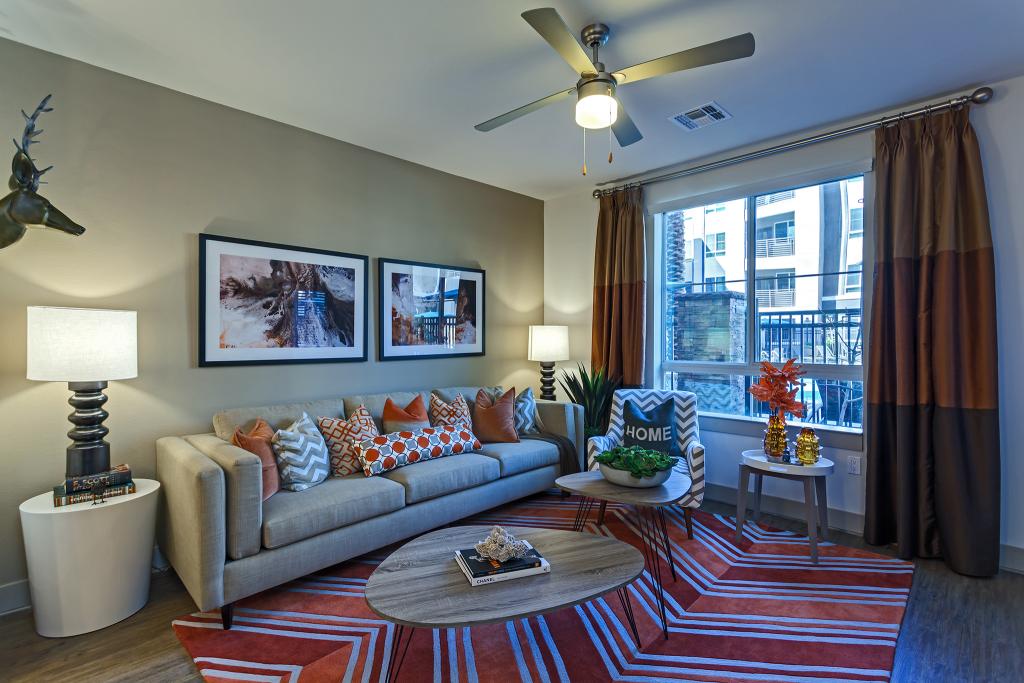 camden-hayden-tempe-arizona-apartments-living-room-one-bedroom-lights-on.jpg