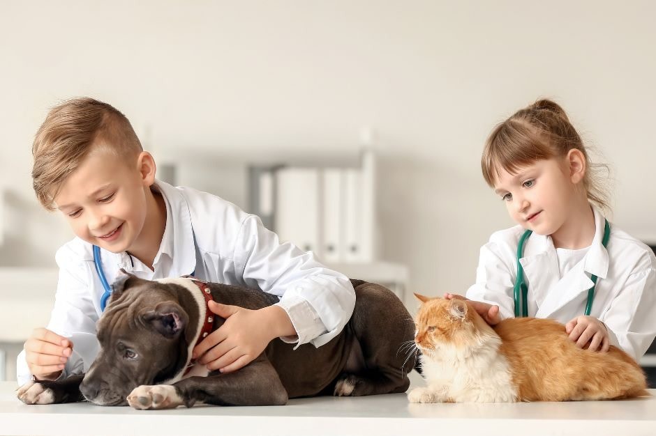 Two young children attending a veterinarian club day camp at the Kitchener Waterloo Humane Society