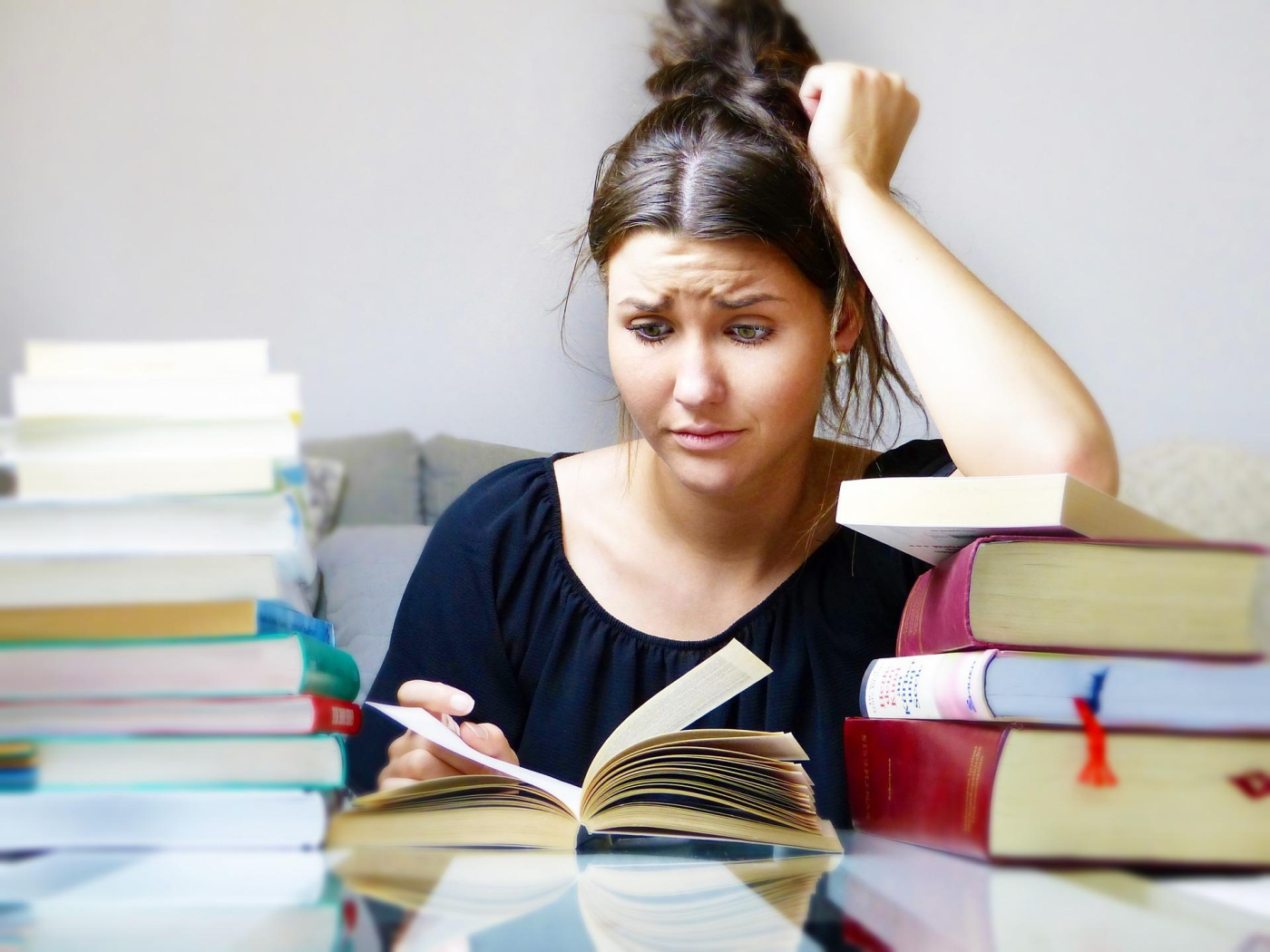Woman struggling to study for an exam