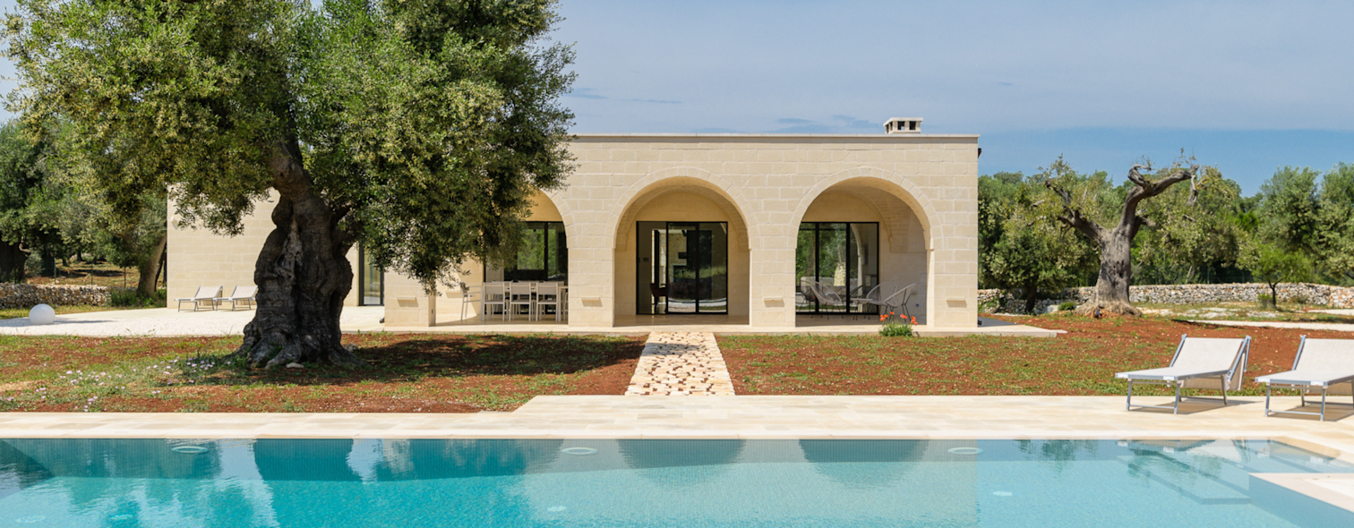 The exterior of a villa in Puglia with a private garden and pool