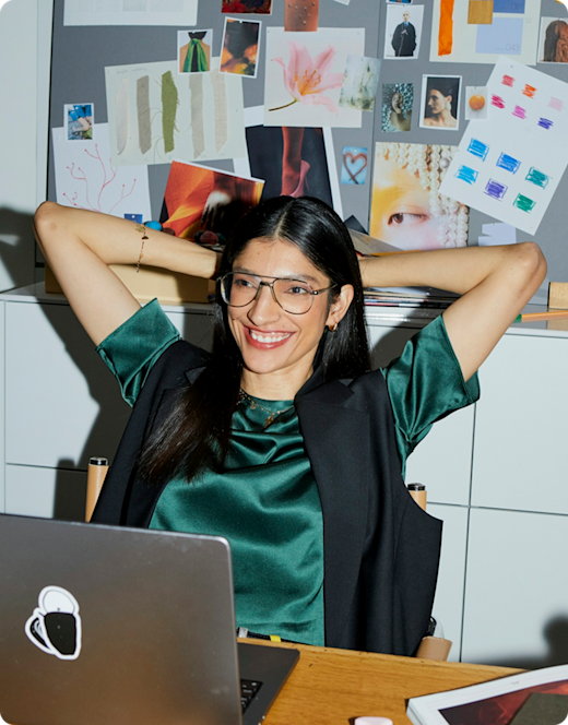 Picture of woman leaning back with hands behind her head
