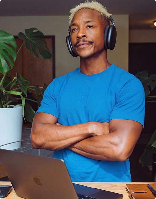 Man wearing headphones and crossing his arms