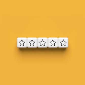  Ratings Star Dices on Yellow Background (medium)
