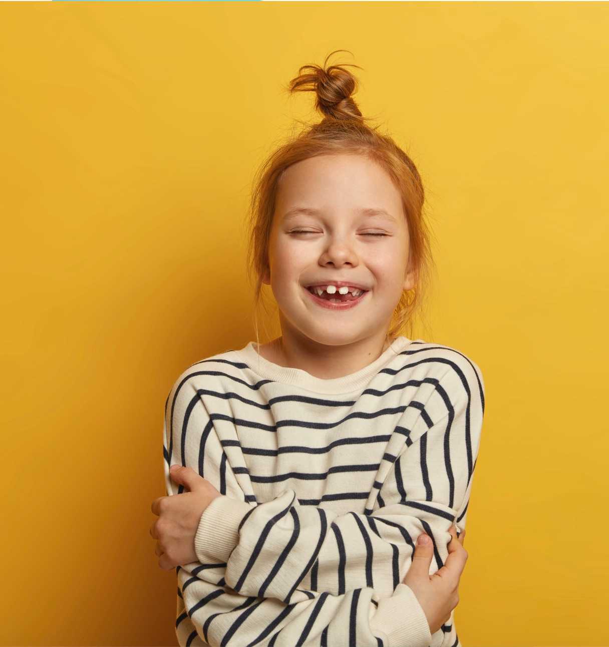 Little girl smiling with closed eyes (top)