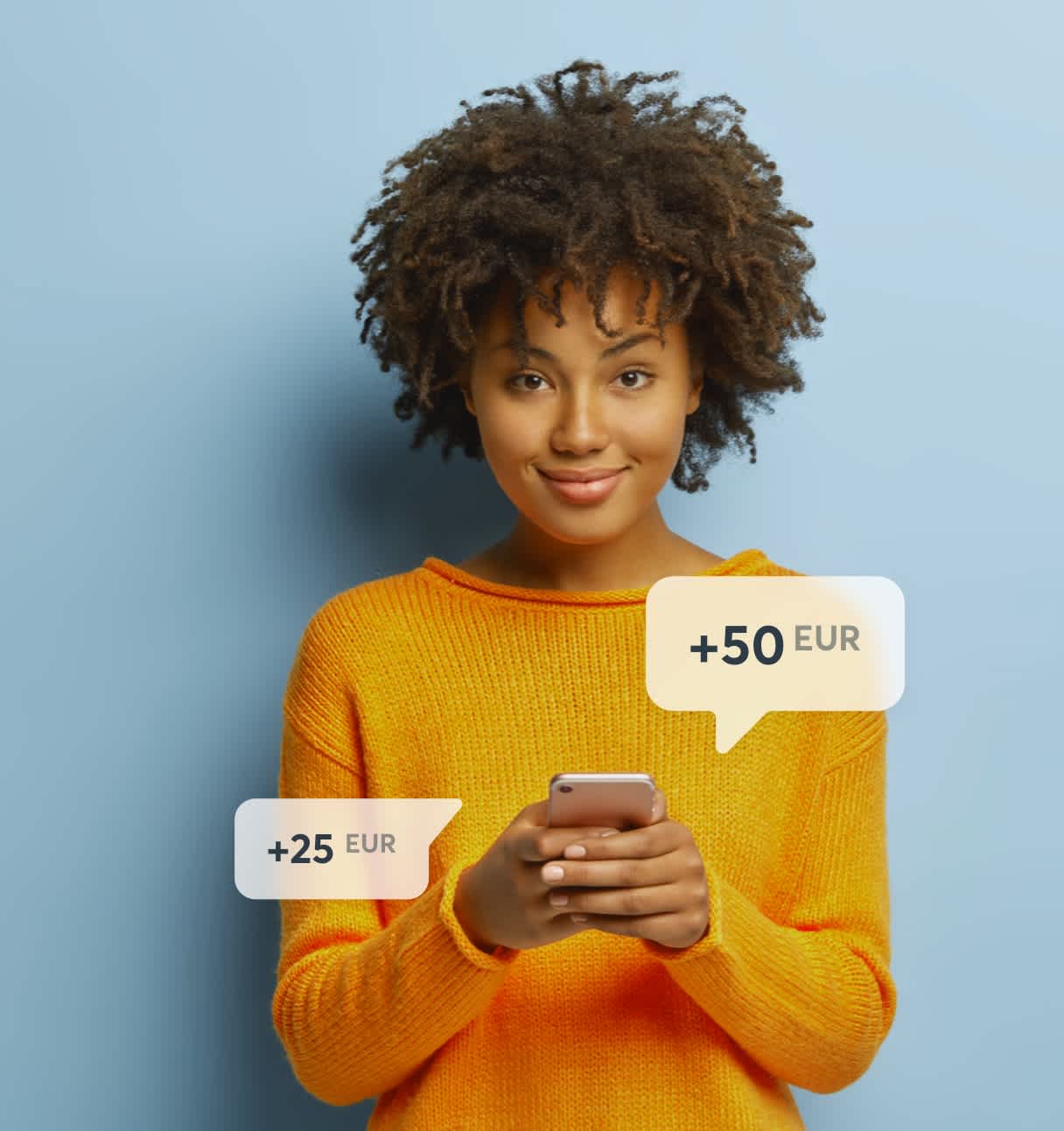 Smiling woman in yellow sweater holding a mobile phone (top block)