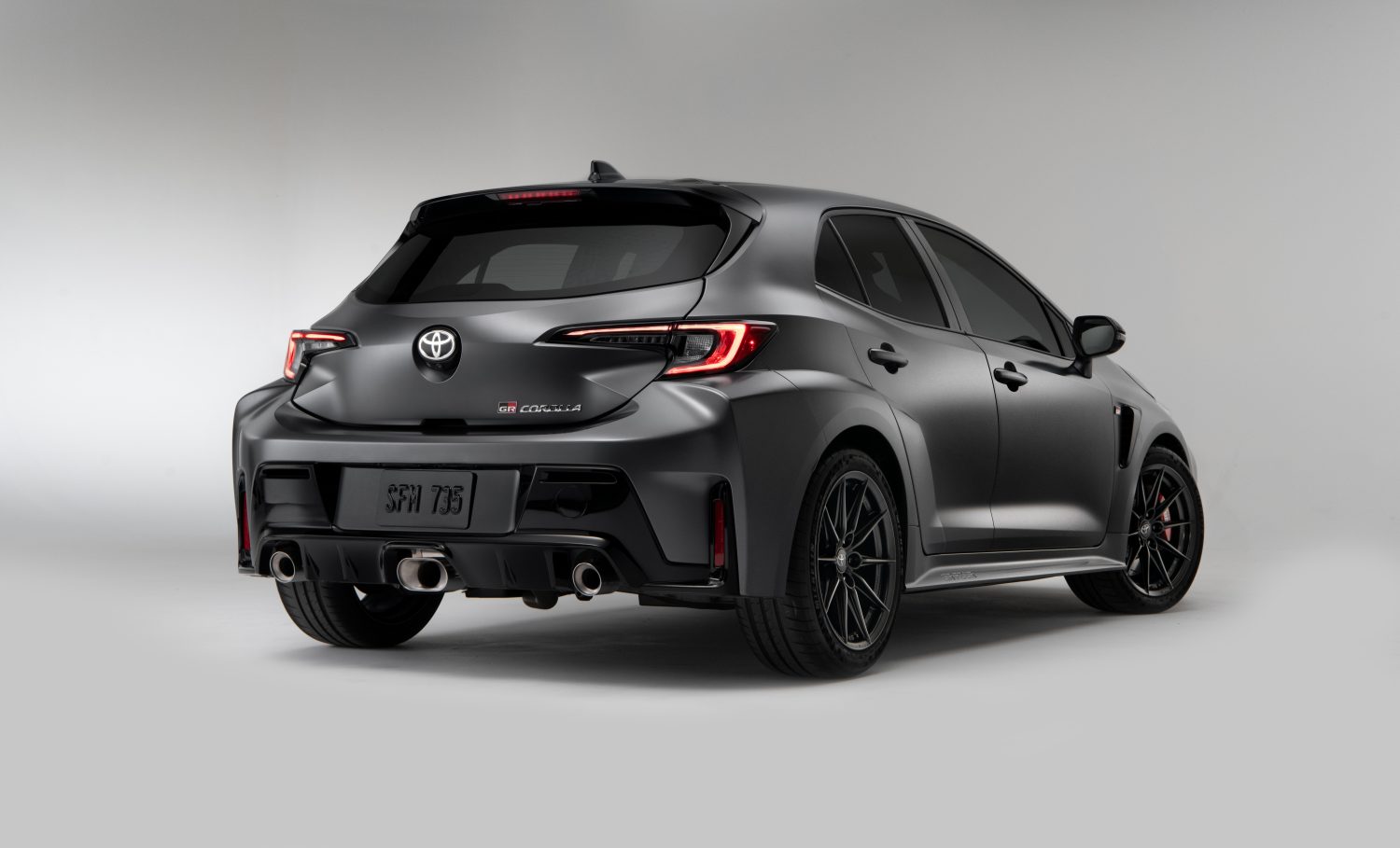 the back view of a black 2023 GR Corolla Morizo Edition