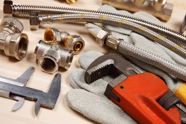 Set of plumbing and tools on the table