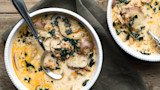 Creamy Zuppa Toscana with sliced potatoes, kale and sausage in white bowls
