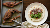 Barbacoa taco on flour tortilla with chopped onion and cilantro; roasted meat on baking tray