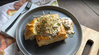 Square puff pastry topped with creamy mushroom-vegetable filling and crispy fried leeks