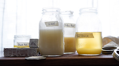 Jars and blocks of animal fats labeled "Lard", "Tallow Beef", "Bear Grease", "Duck Fat"
