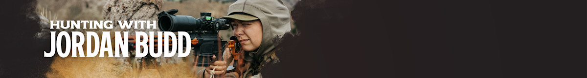 HUNTING WITH JORDAN BUDD, hunter aiming rifle through scope in camo hooded jacket